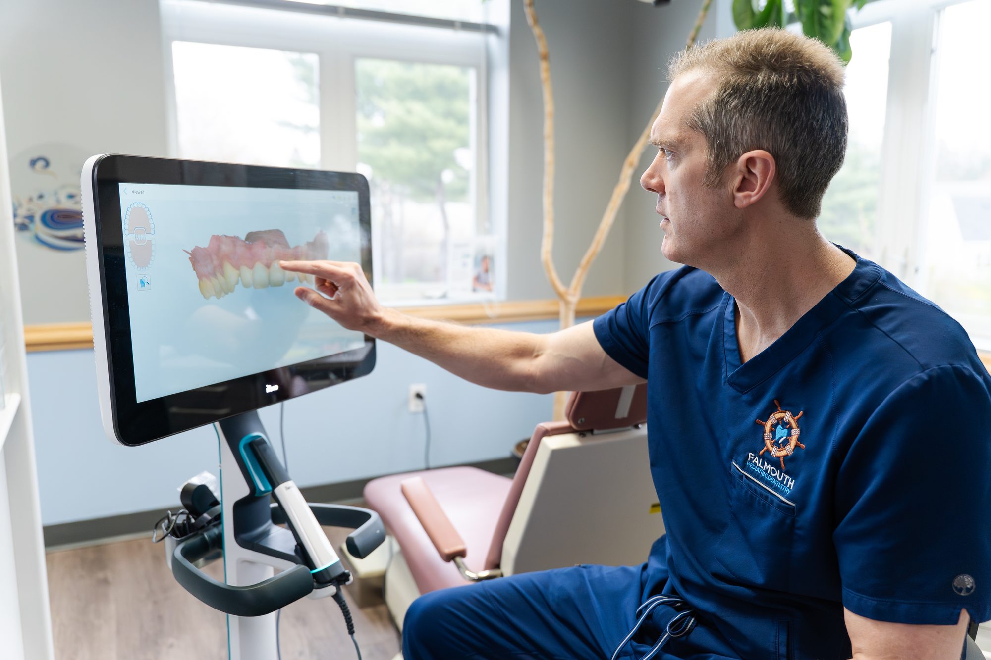 Dentist reviewing teeth scan at Falmouth Pediatric Dentistry in Falmouth, ME