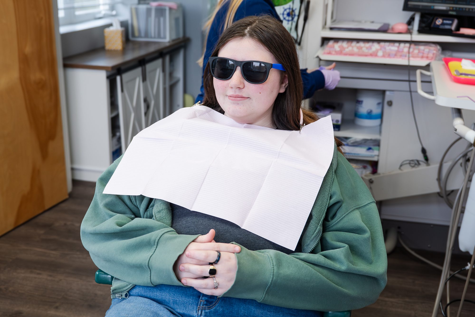 Falmouth Pediatric Dentistry ocean-themed waiting area with navy anchor rug and coastal decor in Falmouth, ME